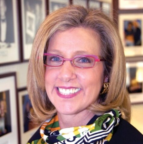 woman with blonde hair and glasses