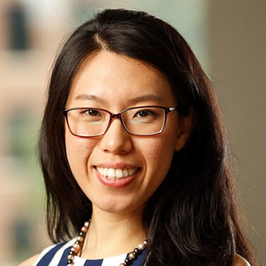 asian woman with dark hair and glasses