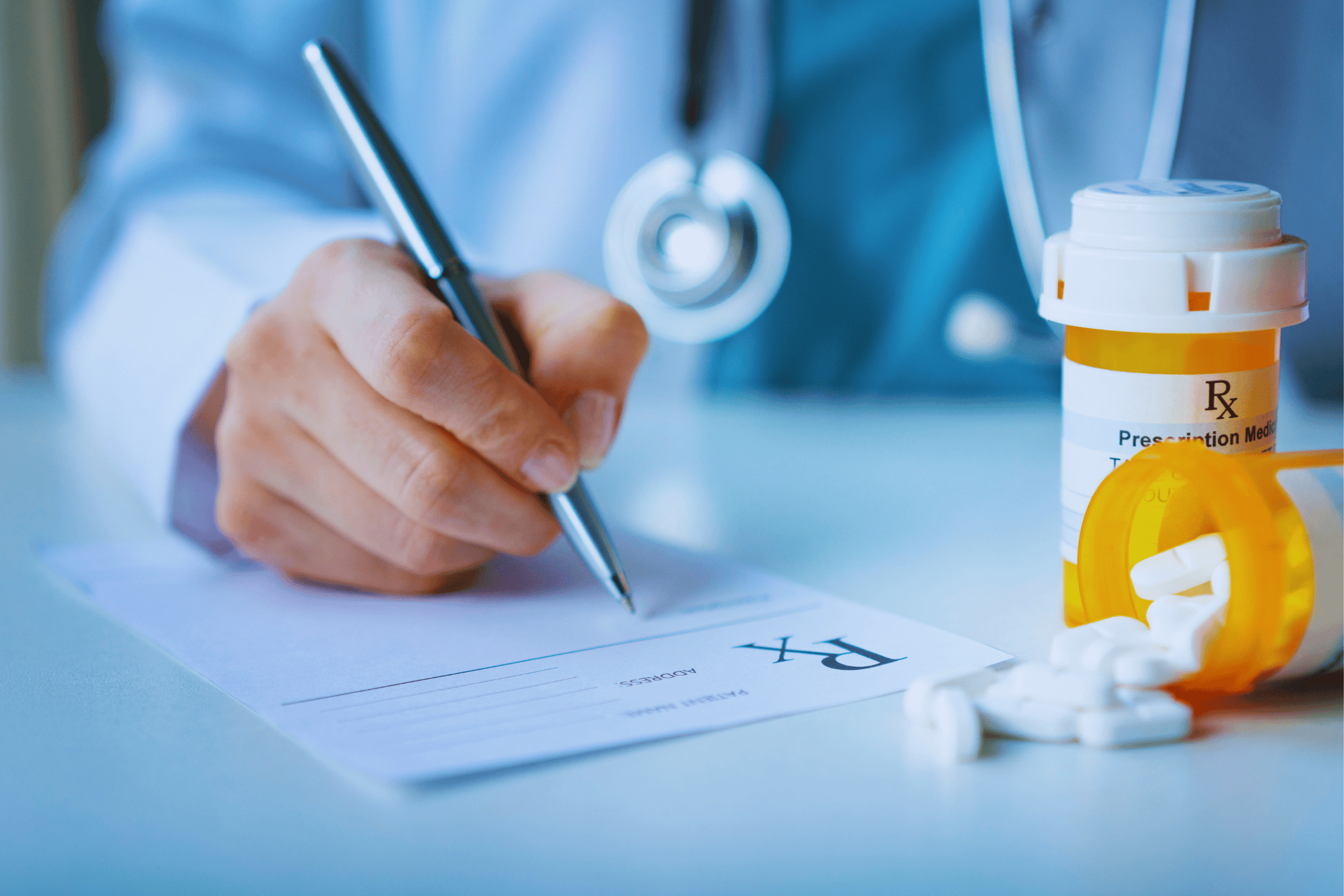 person writing prescription