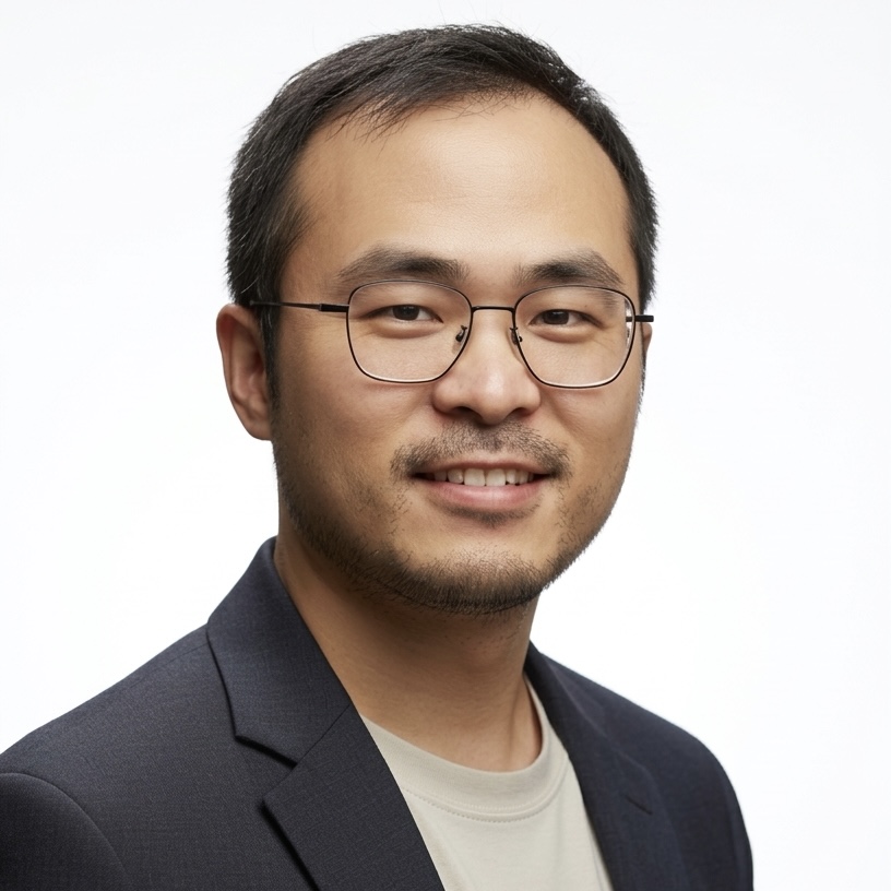 man with brown hair and glasses
