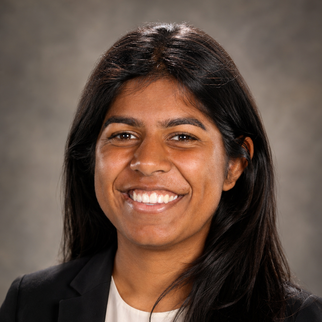 headshot of Riya Kunderan